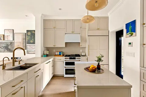 a kitchen with cabinets and appliances