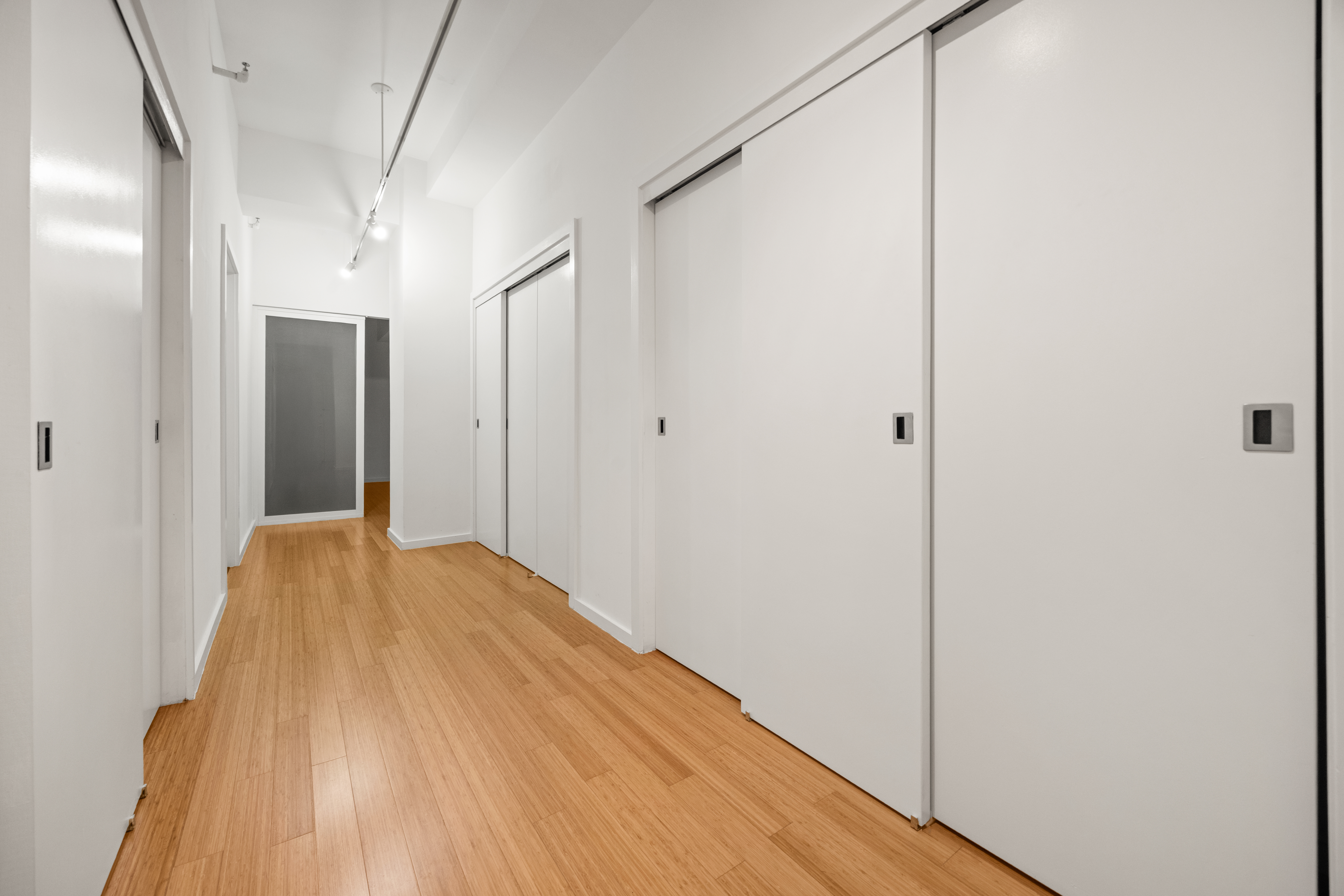 365 Bridge Street, Unit 5N Brooklyn, NY 11201 - Photo 5 of 12 a view of empty room with wooden floor