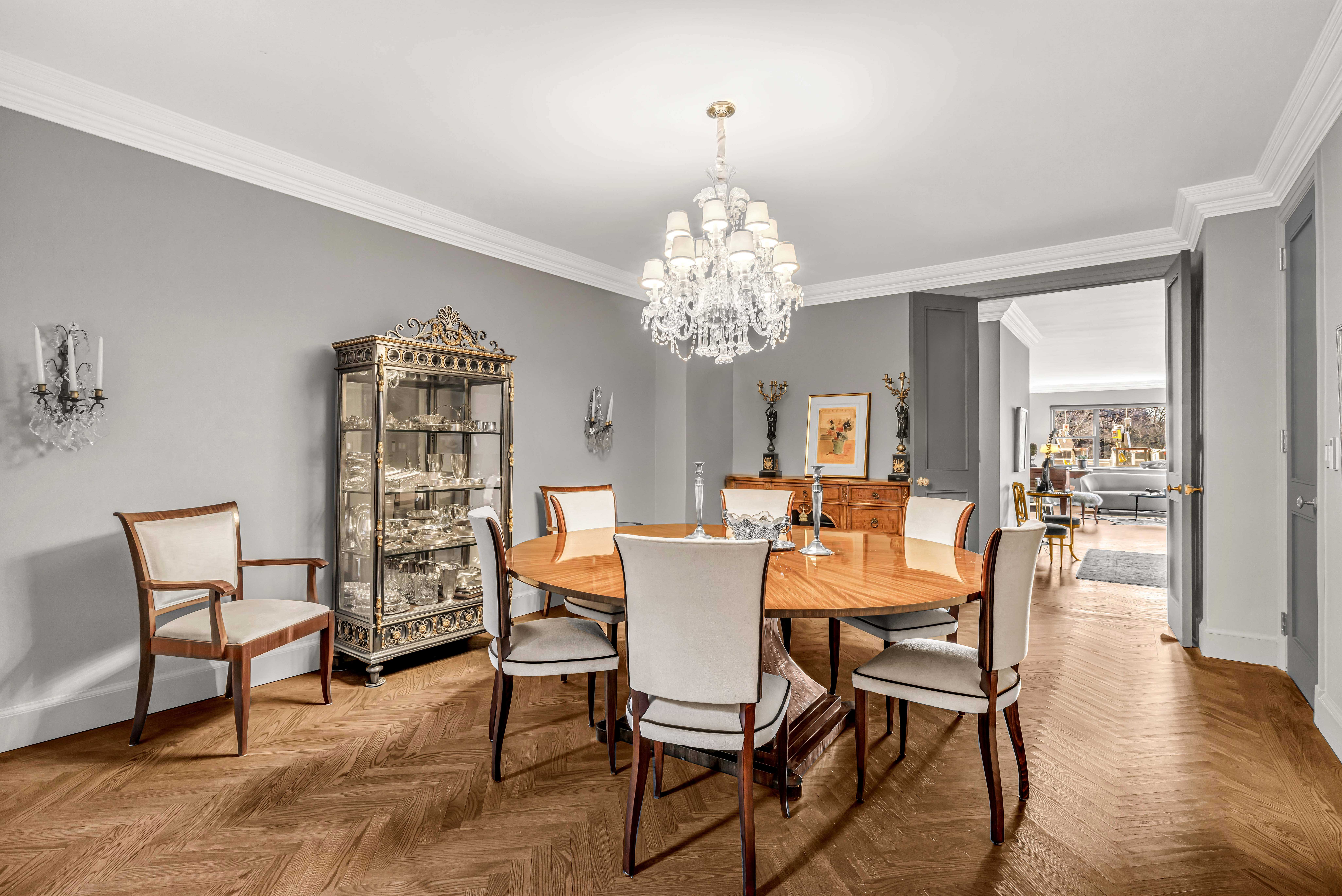 785 5th Avenue, Unit 3C Manhattan, NY 10022 - Photo 5 of 16 a view of a dining room with furniture and wooden floor