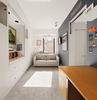 a bedroom with a bed and couch