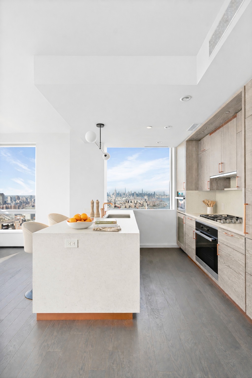 1 City Point, Unit 55A Brooklyn, NY 11201 - Photo 2 of 15 a large white kitchen with a stove a sink a microwave and cabinets