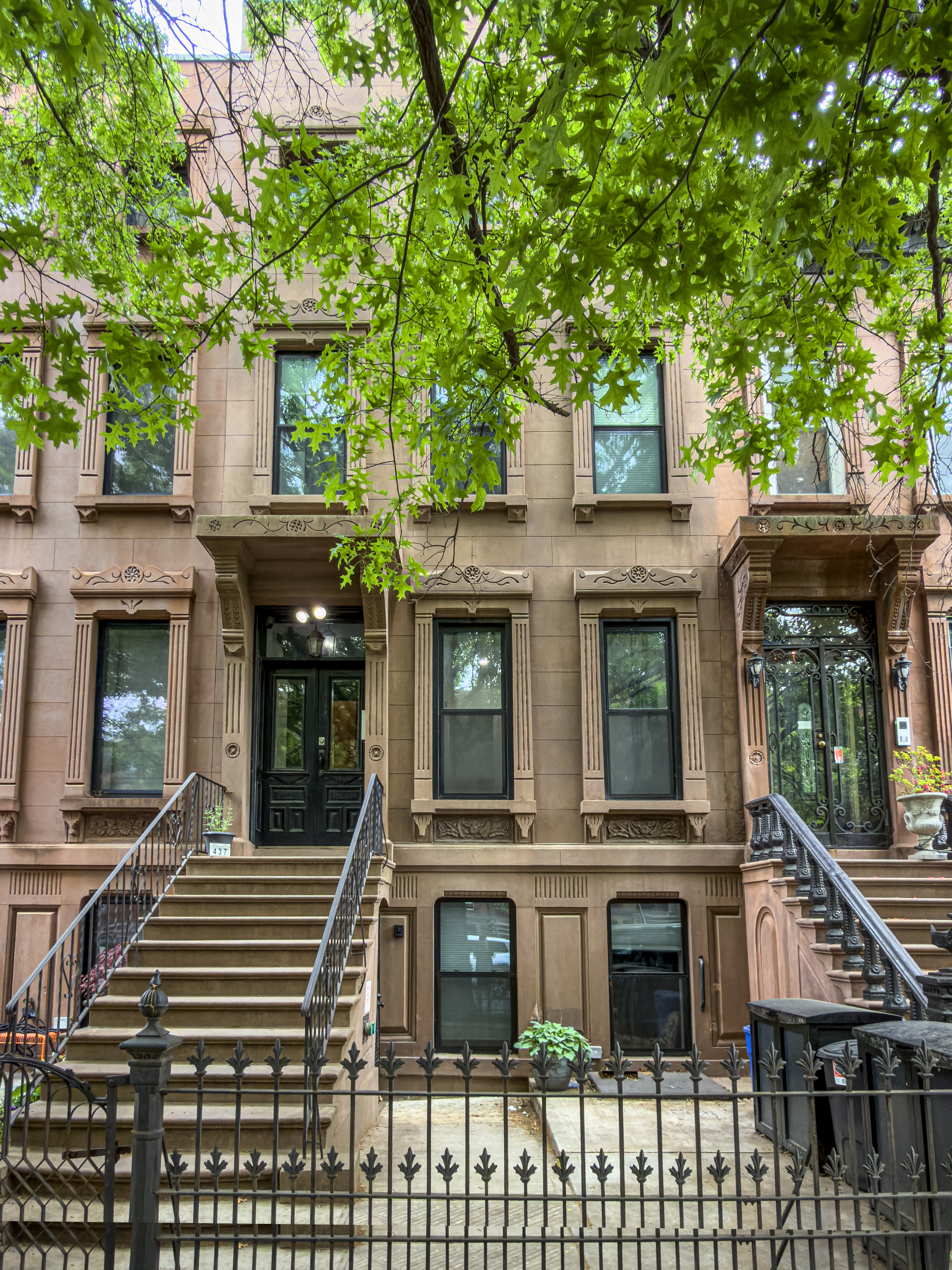 437 Putnam Avenue, Unit 2 Brooklyn, NY 11221 - Photo 2 of 9 a front view of a house with a garden