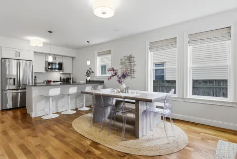 a kitchen with counter top space a sink and appliances