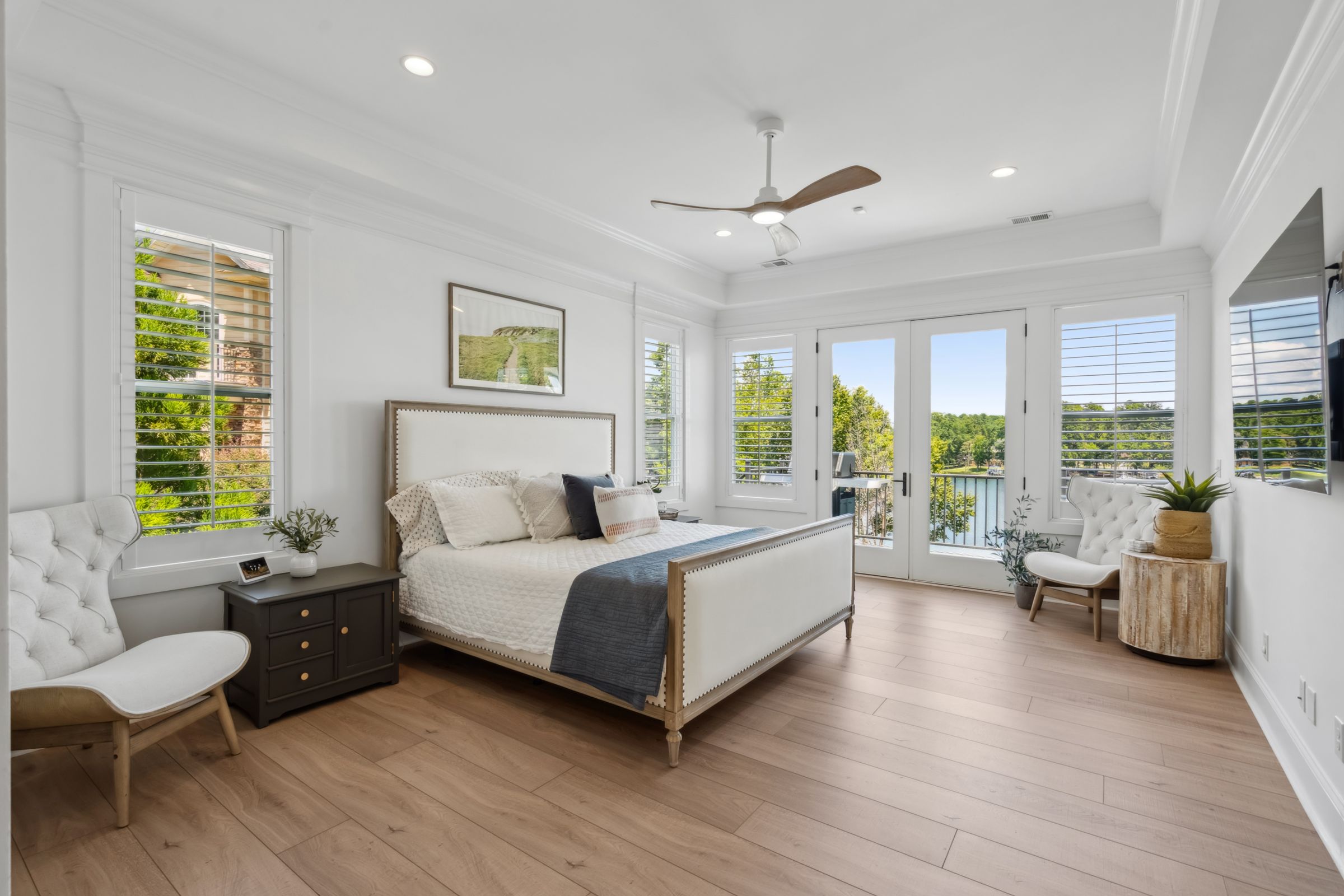 249 Pointe Overlook Drive Chapin, SC 29036 - Photo 21 of 56 a spacious bedroom with a bed and large glass window