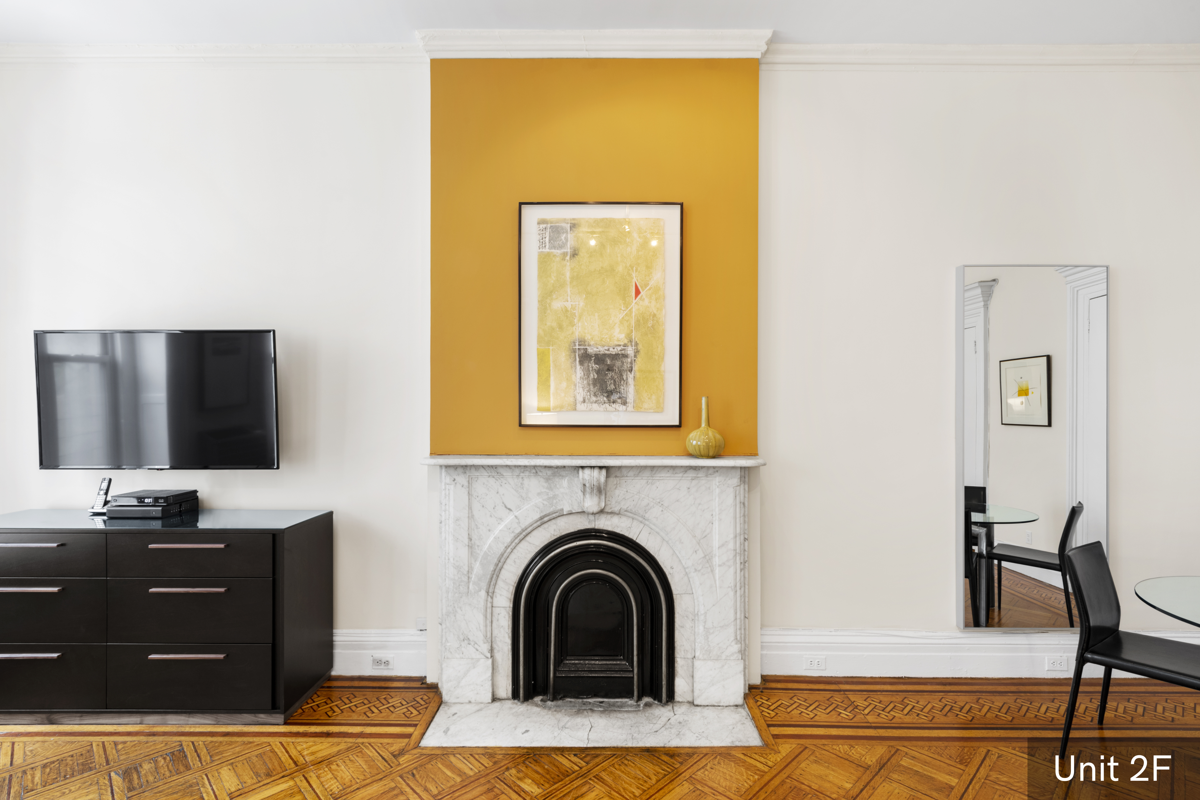 120 East 19th Street Manhattan, NY 10003 - Photo 23 of 33 a living room with furniture and a fireplace