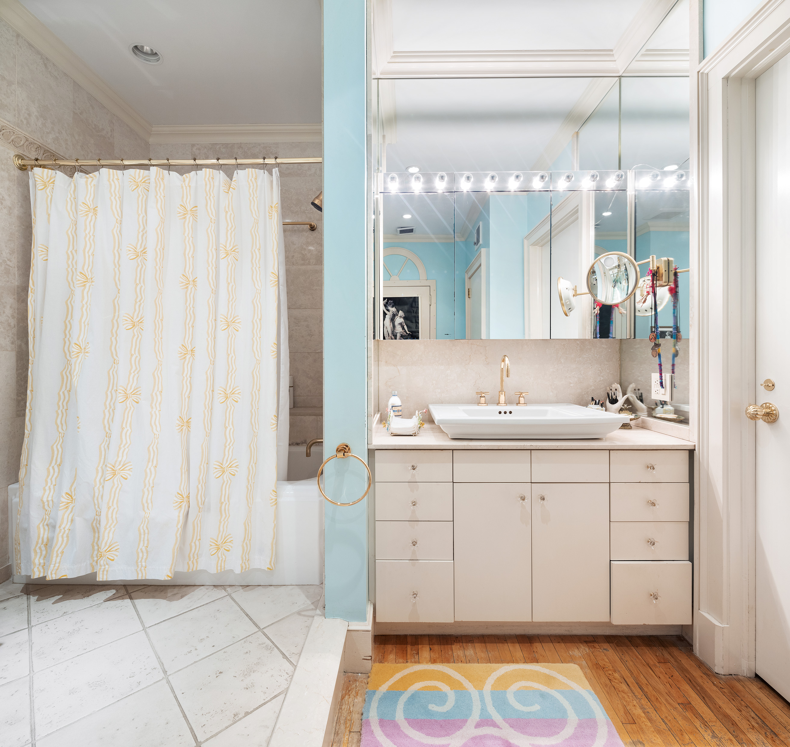 59 Wooster Street, Unit 3E Manhattan, NY 10012 - Photo 9 of 12 a spacious bathroom with a sink a mirror and a shower