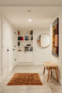 a living room with furniture and a rug