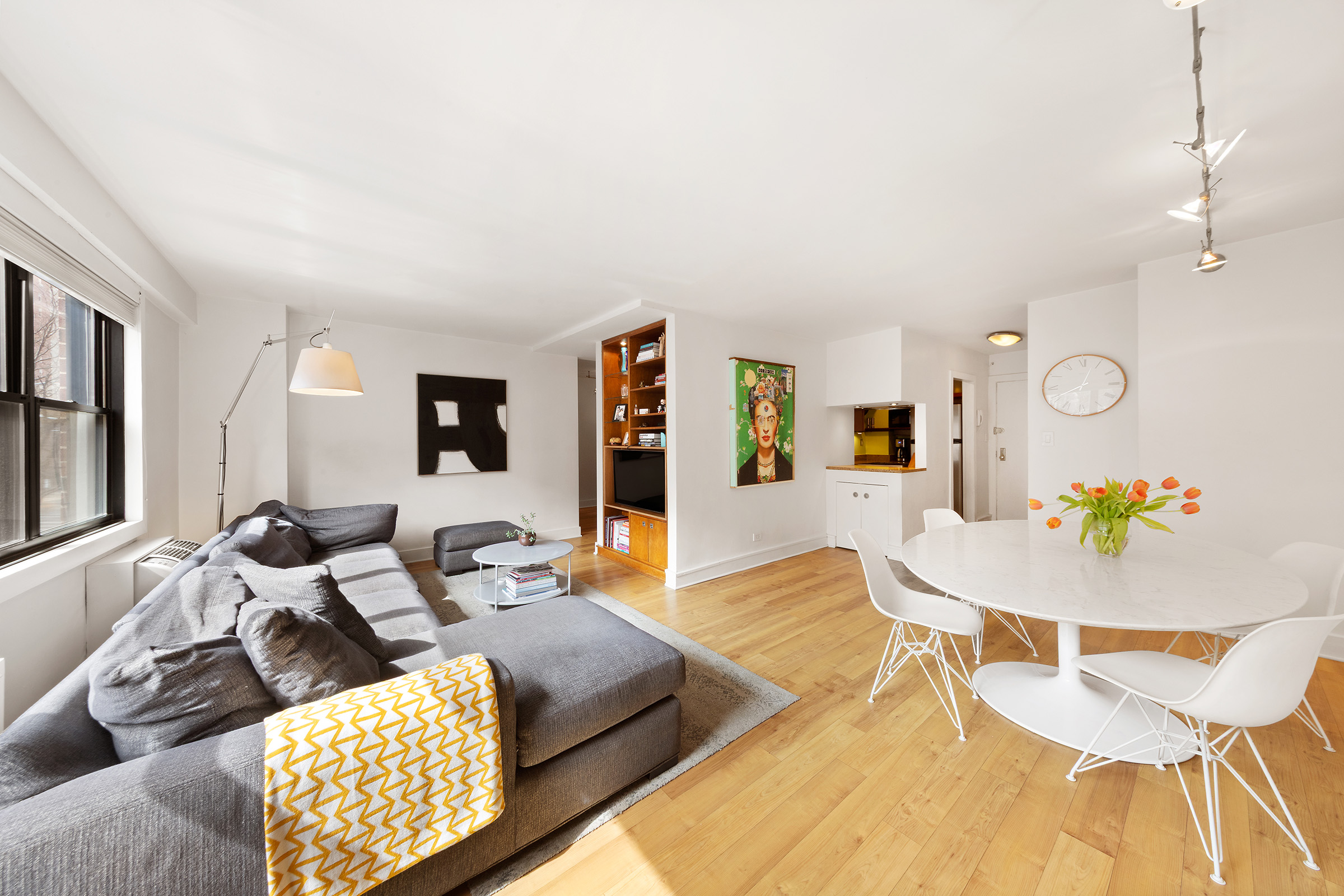 31 Jane Street, Unit 2CD Manhattan, NY 10014 - Photo 2 of 18 a living room with furniture and wooden floor