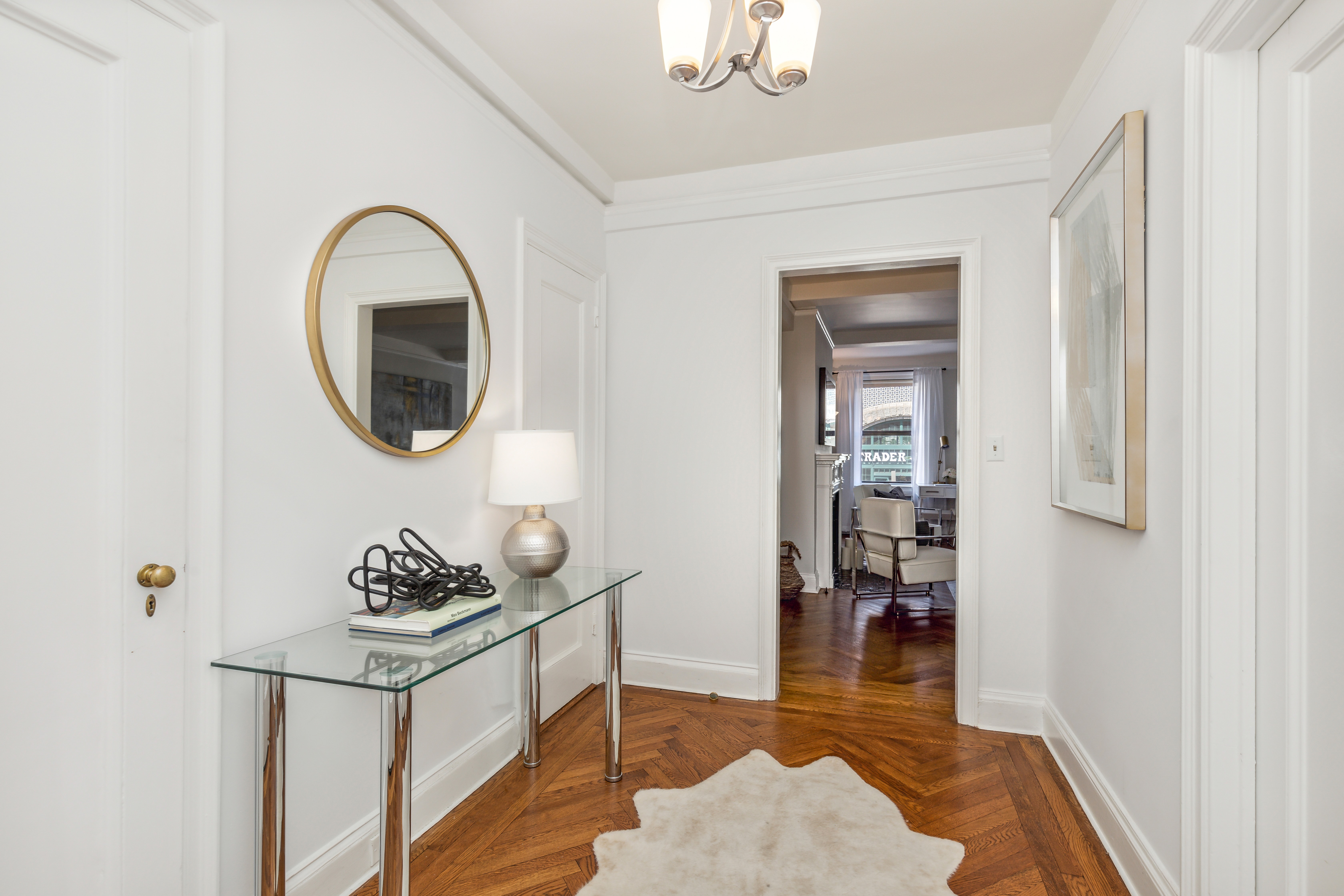 400 East 59th Street, Unit 2D Manhattan, NY 10022 - Photo 4 of 8 a living room with furniture and a wooden floor