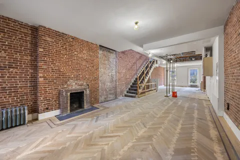 a view of an empty room with stairs