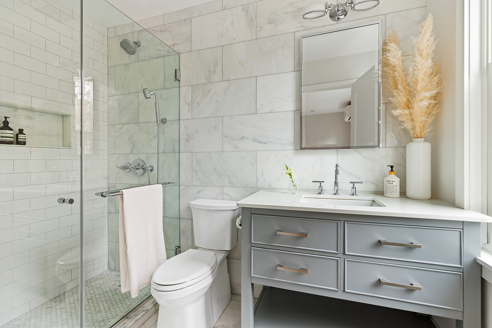 682 A 6th Avenue Brooklyn, NY 11215 - Photo 6 of 16 a bathroom with a granite countertop toilet sink and mirror