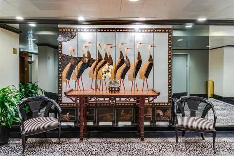 a view of a chairs and table in a room