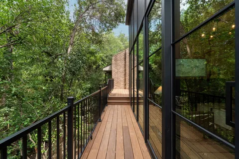 a view of balcony and wooden floor