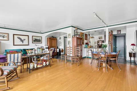 a livingroom with furniture and wooden floor