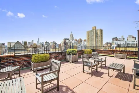 a view of a terrace with sitting area
