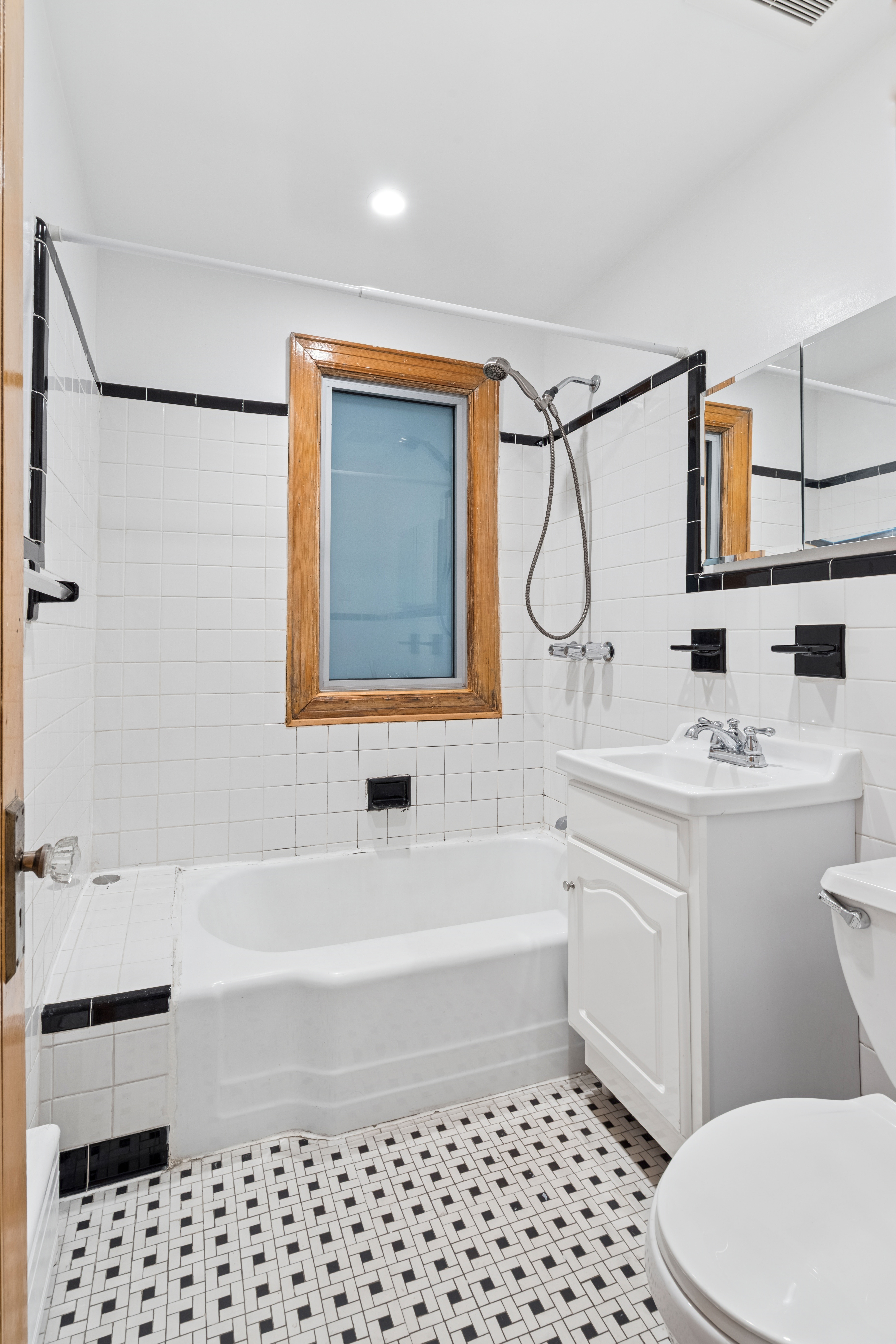 1515 11th Avenue, Unit 1 Brooklyn, NY 11215 - Photo 6 of 11 a bathroom with a sink a toilet and shower