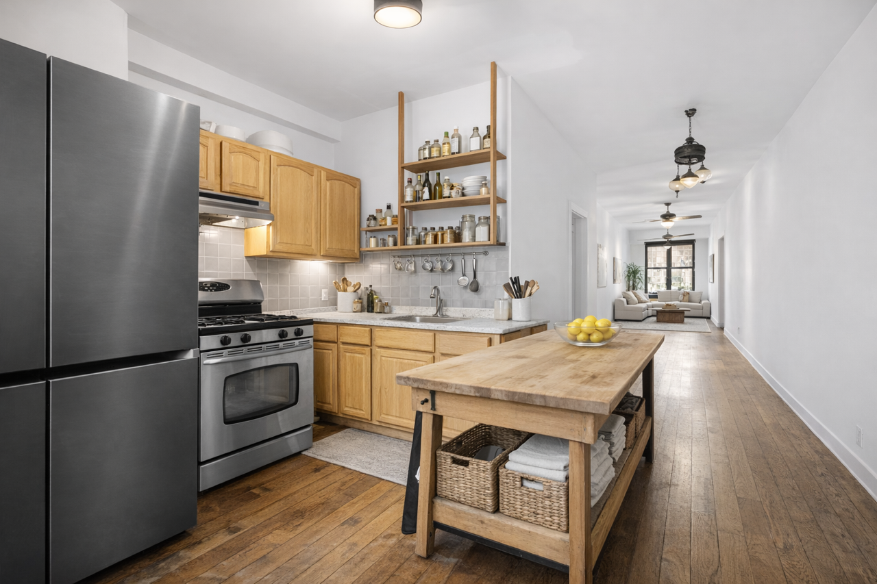 301 23rd Street Brooklyn, NY 11215 - Photo 5 of 13 a kitchen with a refrigerator a stove a sink and a dining table with wooden floor