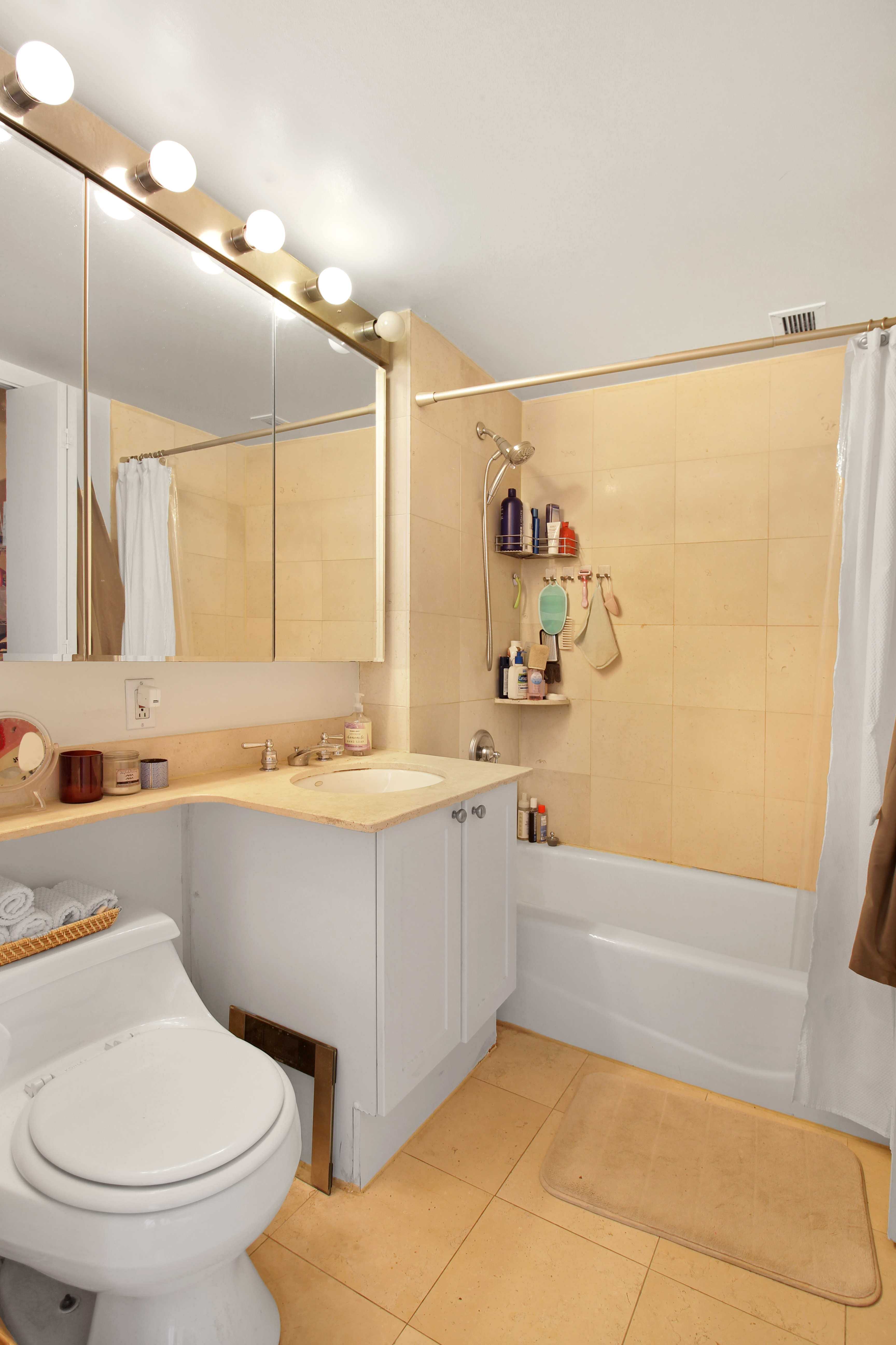 308 East 38th Street, Unit 20A Manhattan, NY 10016 - Photo 11 of 13 a bathroom with a sink a toilet and a bathtub