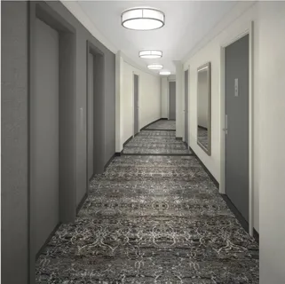 a view of hallway with wooden floor