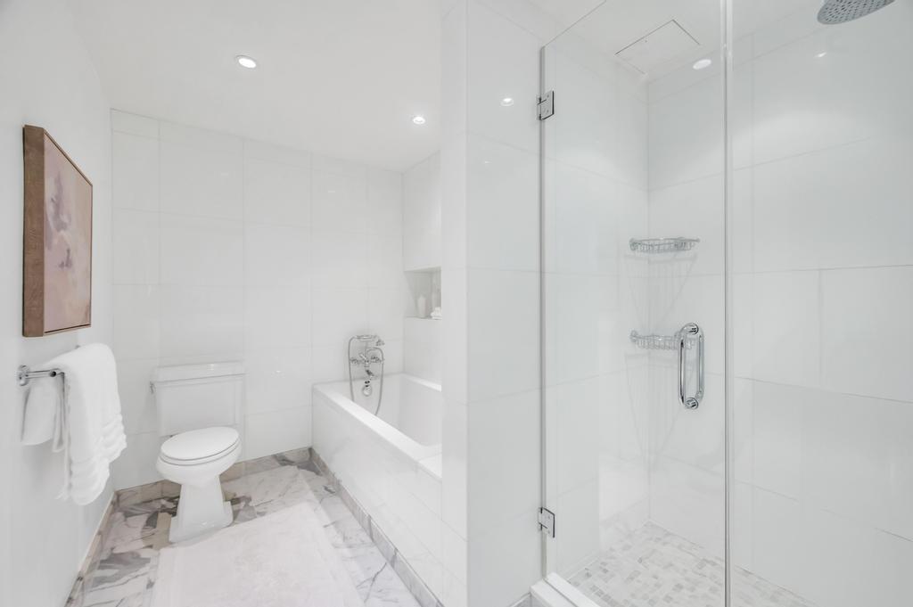 333 Rector Place, Unit PH6S Manhattan, NY 10280 - Photo 12 of 26 a bathroom with a toilet sink and shower