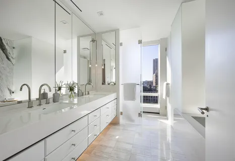 a bathroom with a double vanity sink a and a mirror