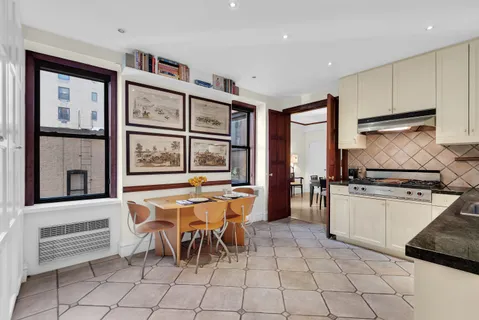 a kitchen with stainless steel appliances granite countertop a stove and a refrigerator