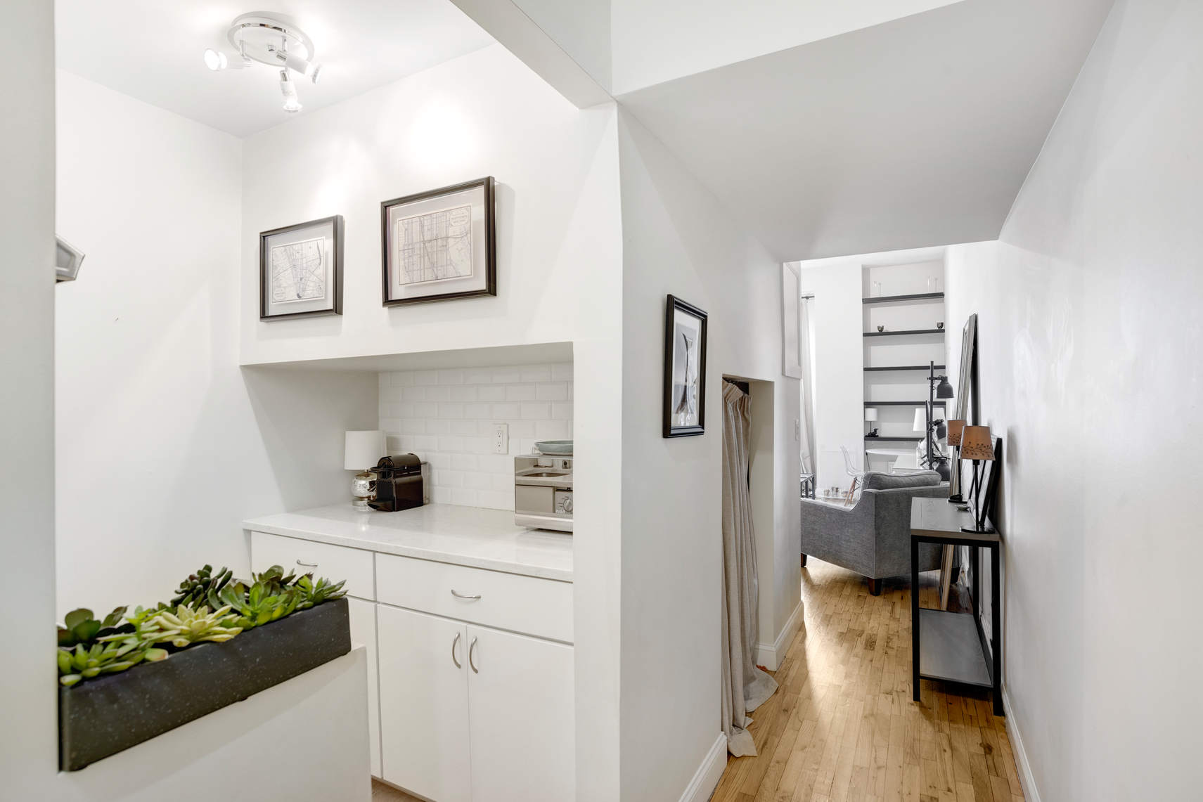 310 East 23rd Street, Unit 7C Manhattan, NY 10010 - Photo 10 of 18 a kitchen with a refrigerator and a stove top oven