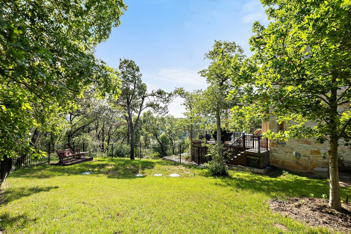 1607 The High Road Austin, TX 78746 - Photo 25 of 28 a view of yard with swimming pool and trees