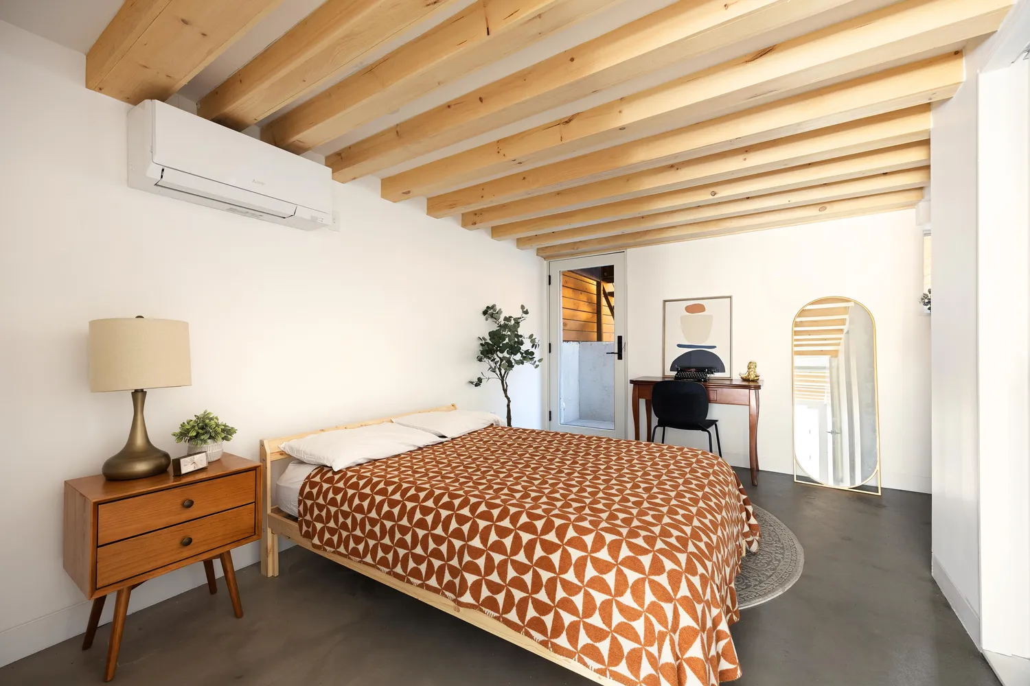 a bedroom with a bed and a table in it