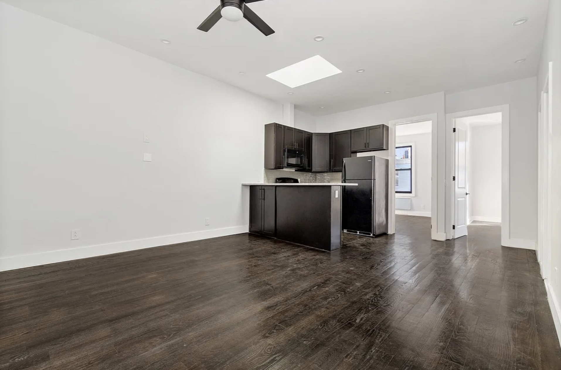 20 Suydam Street, Unit 1 Brooklyn, NY 11221 - Photo 1 of 10 a view of kitchen with wooden floor and electronic appliances