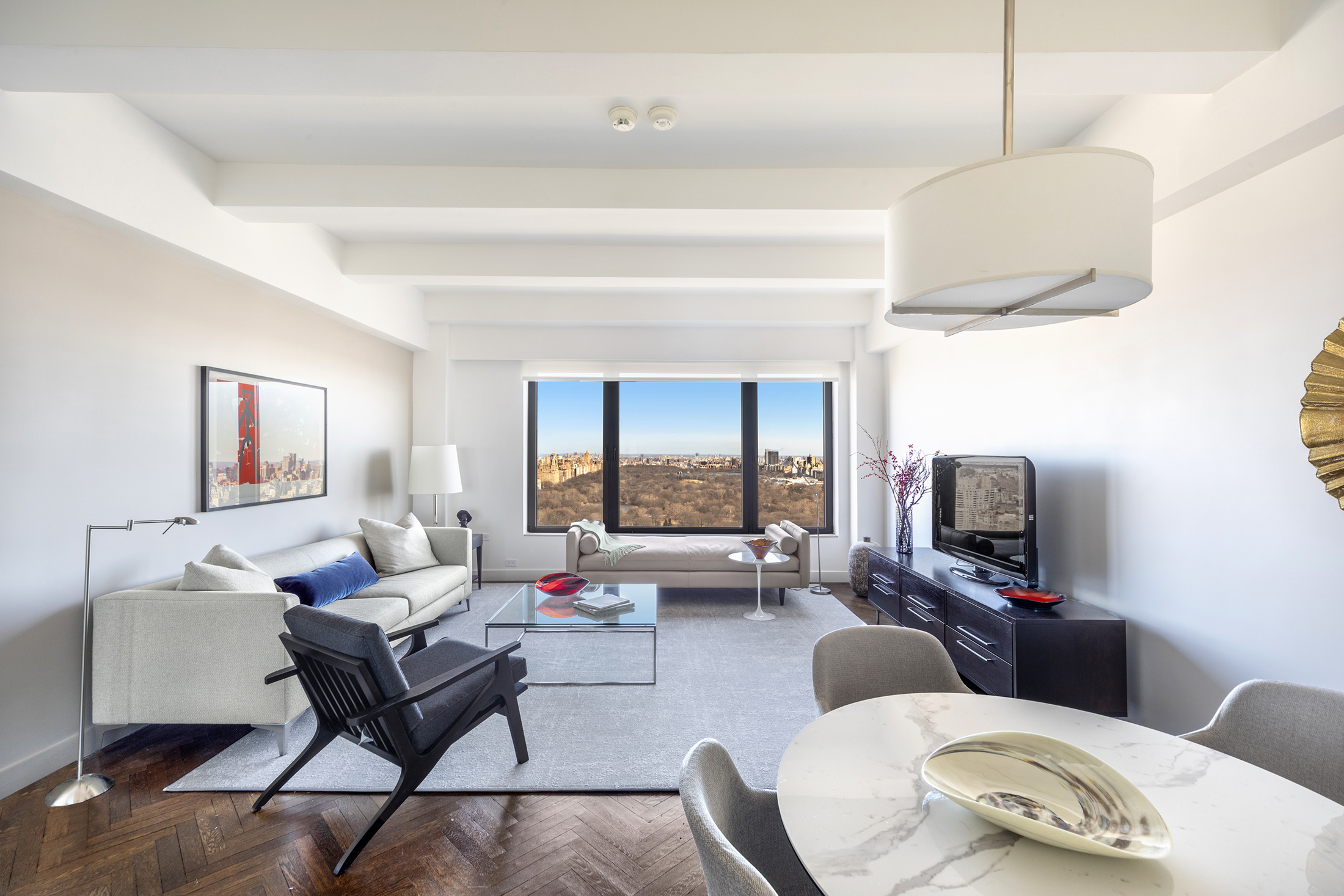 160 Central Park South, Unit 3903 Manhattan, NY 10019 - Photo 2 of 11 a living room with furniture and a flat screen tv