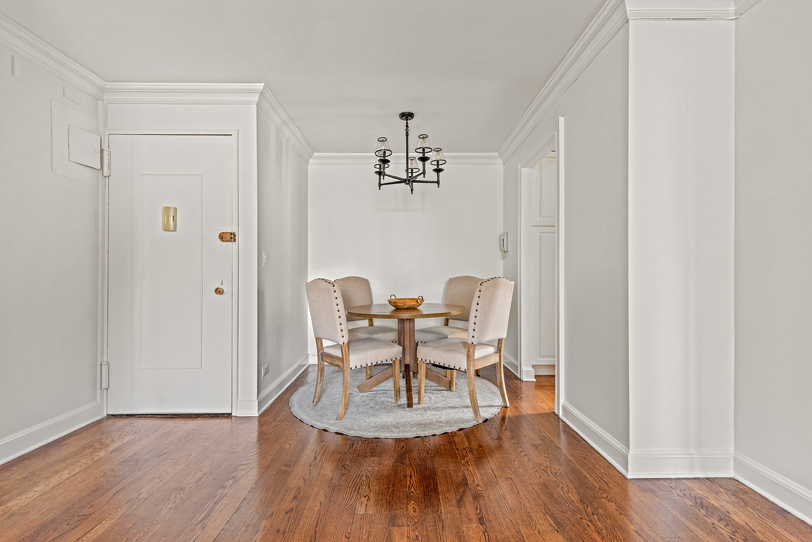 245 East 54th Street, Unit 25ST Manhattan, NY 10022 - Photo 2 of 8 a view of a dining room with furniture and wooden floor