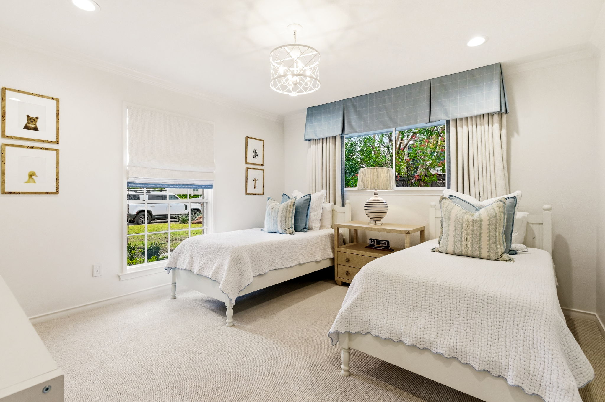 5765 Stonegate Road Dallas, TX 75209 - Photo 28 of 37 a bedroom with two beds and a large window