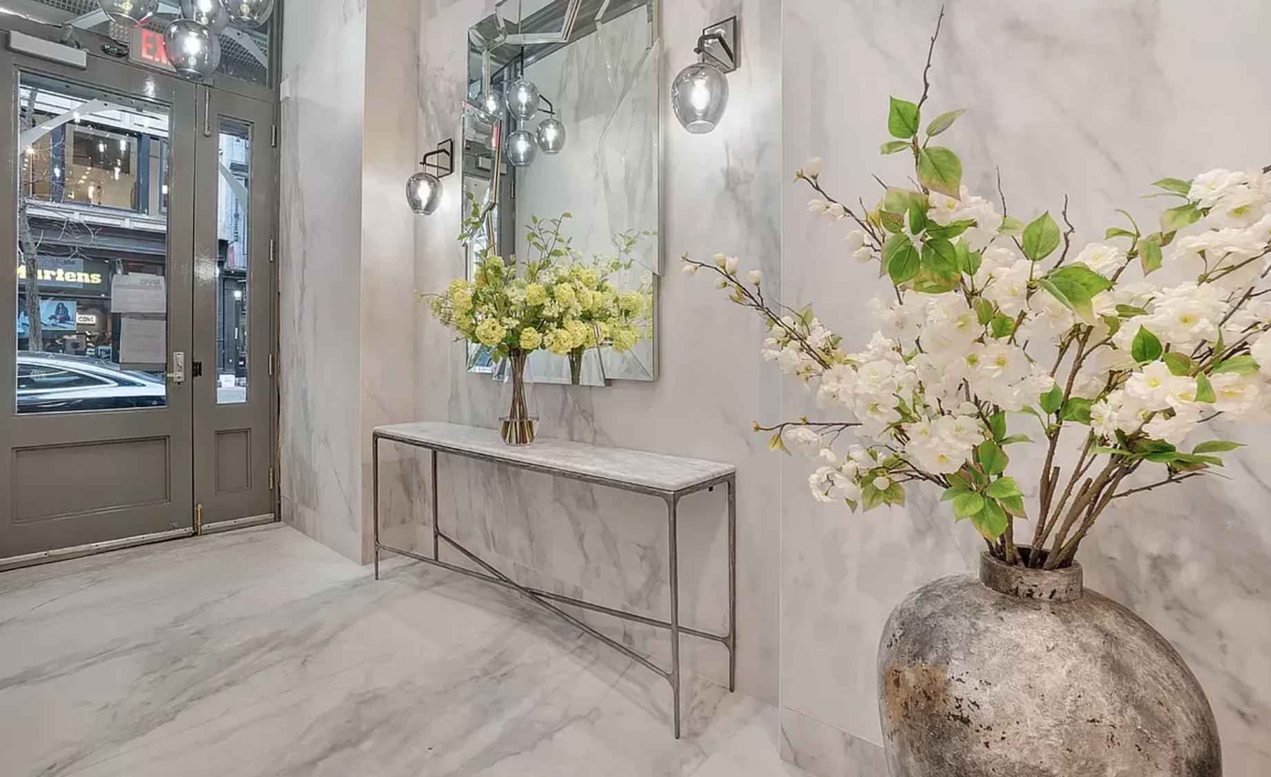 145 Spring Street, Unit PH Manhattan, NY 10012 - Photo 9 of 10 a view of a vase of flowers sitting on a table