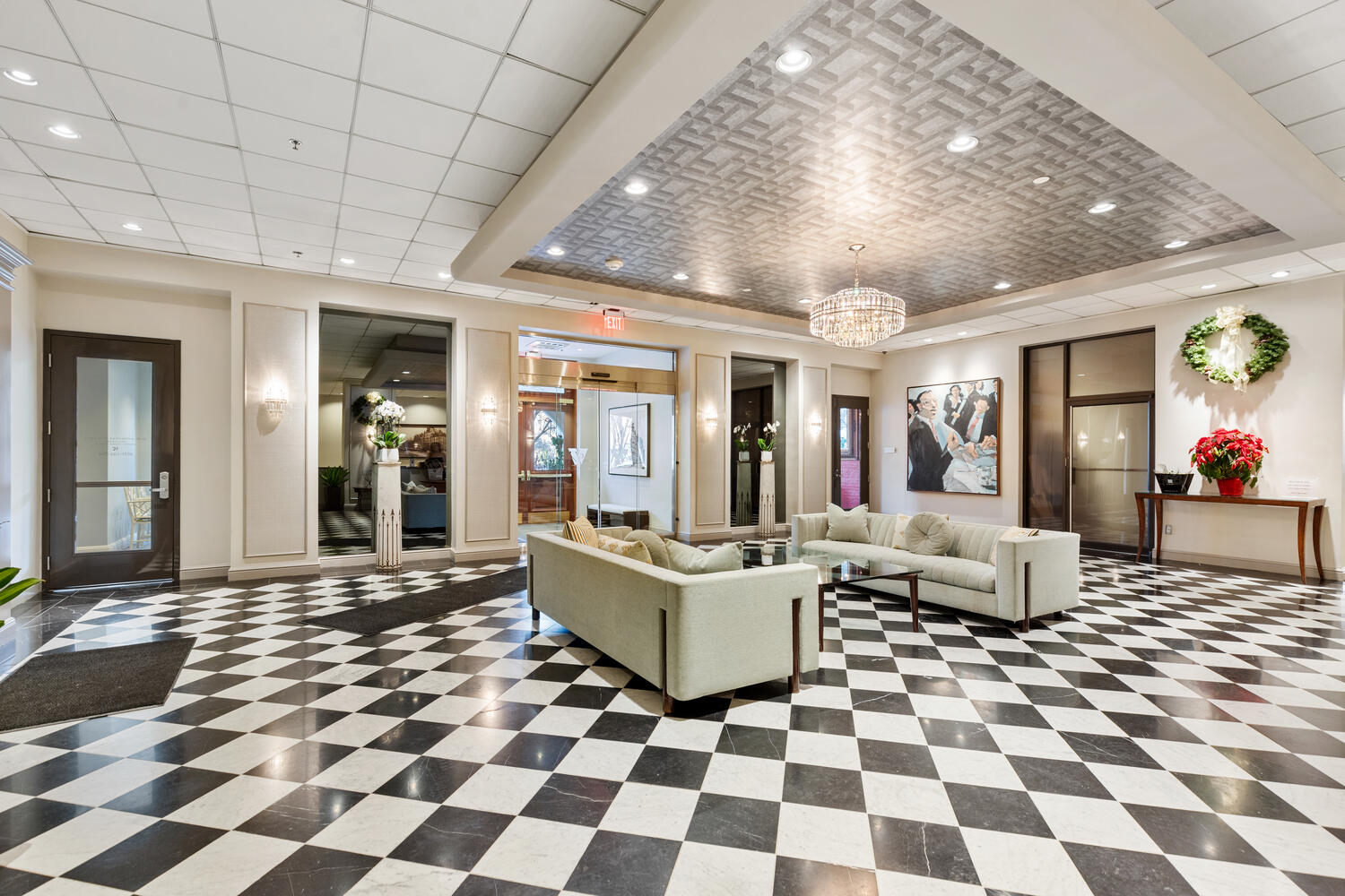 160 Commonwealth Avenue, Unit 410 Boston, MA 02116 - Photo 22 of 31 a living room with a black white checkered floor with couches chair and a coffee table