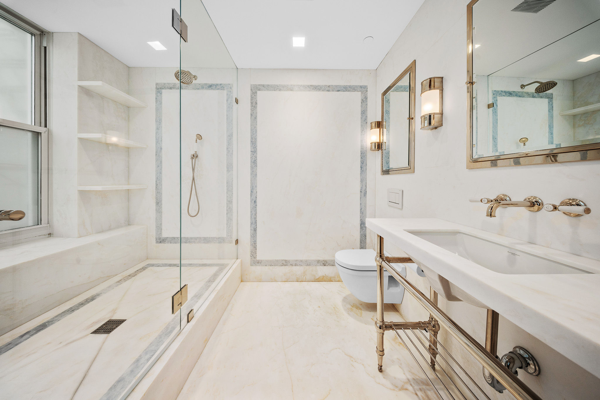 45 Crosby Street, Unit 6 North Manhattan, NY 10012 - Photo 13 of 17 a spacious bathroom with a tub sink and mirror