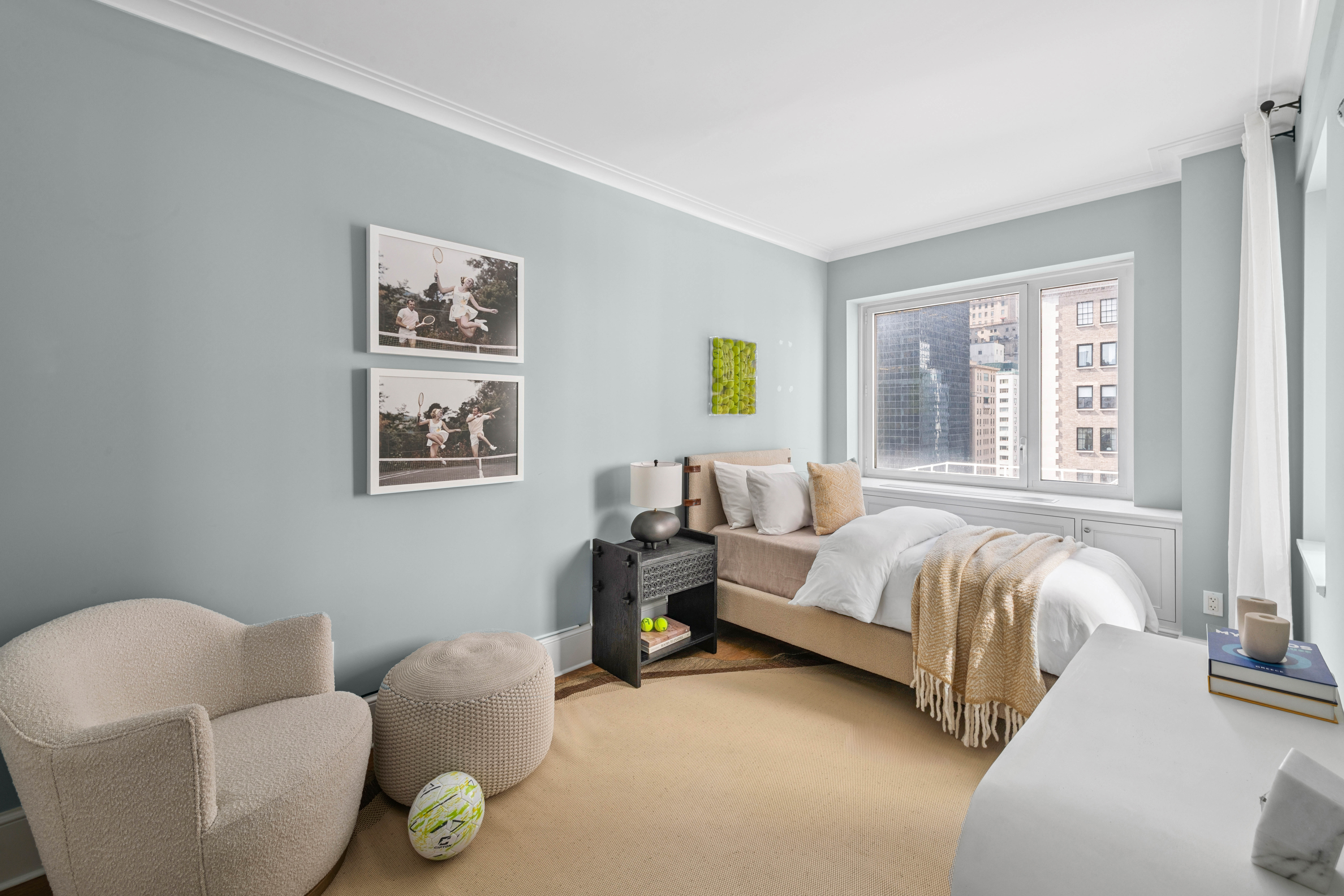 530 Park Avenue, Unit 12A Manhattan, NY 10065 - Photo 15 of 27 a bedroom with bed and a couch