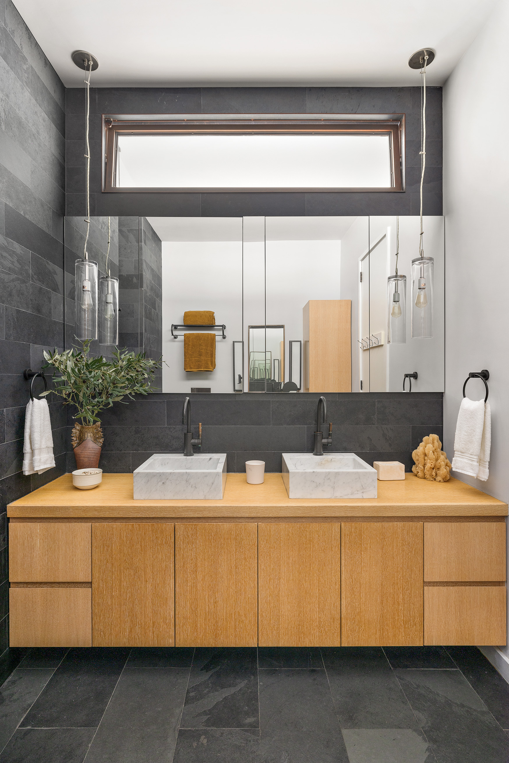 250 Mercer Street, Unit B706B707 Manhattan, NY 10012 - Photo 15 of 25 a bathroom with a sink and a mirror