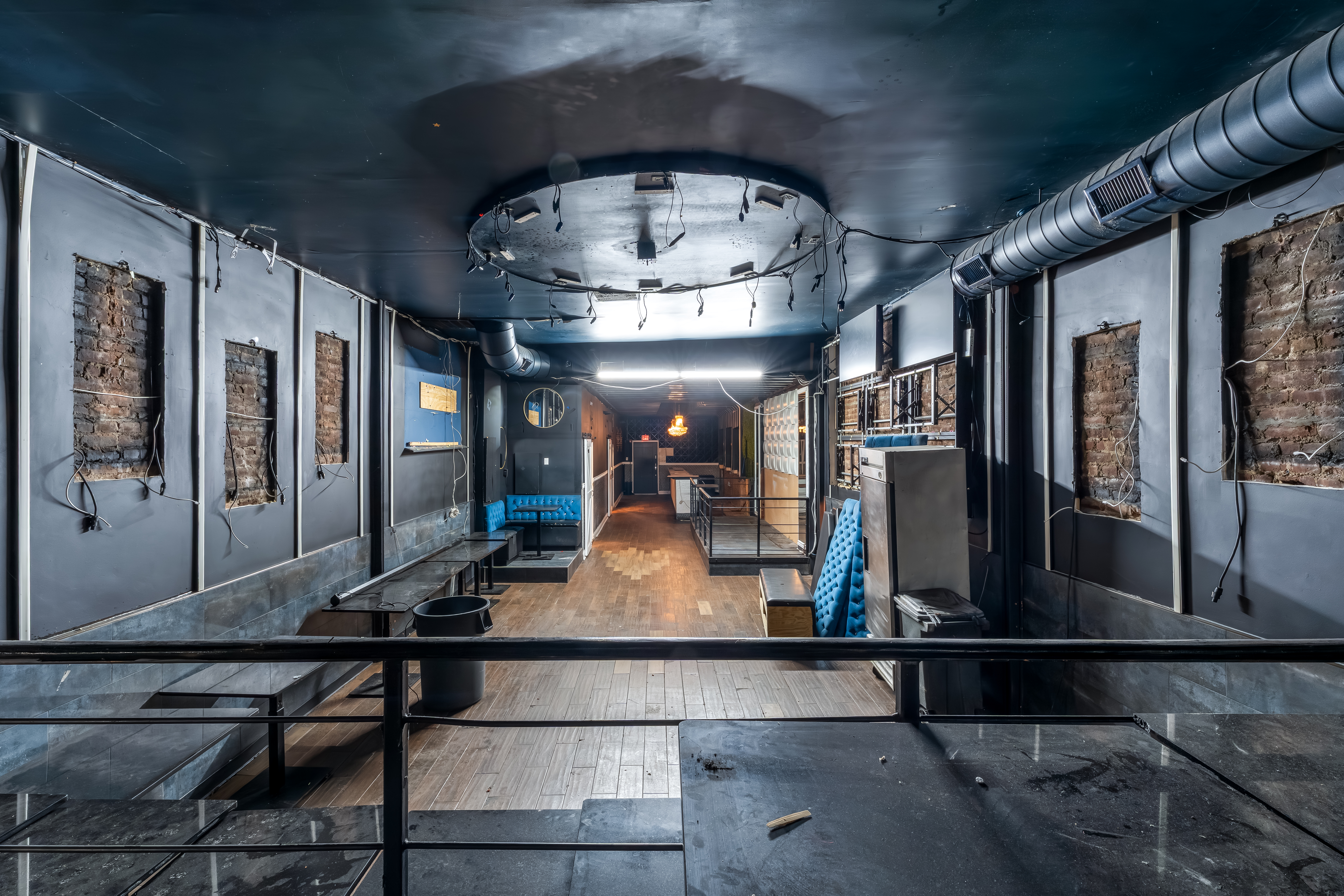 646 Newark Avenue, Unit COMMERCIAL Jersey City, NJ 07306 - Photo 6 of 35 a room with lots of furniture and lots of mirrors