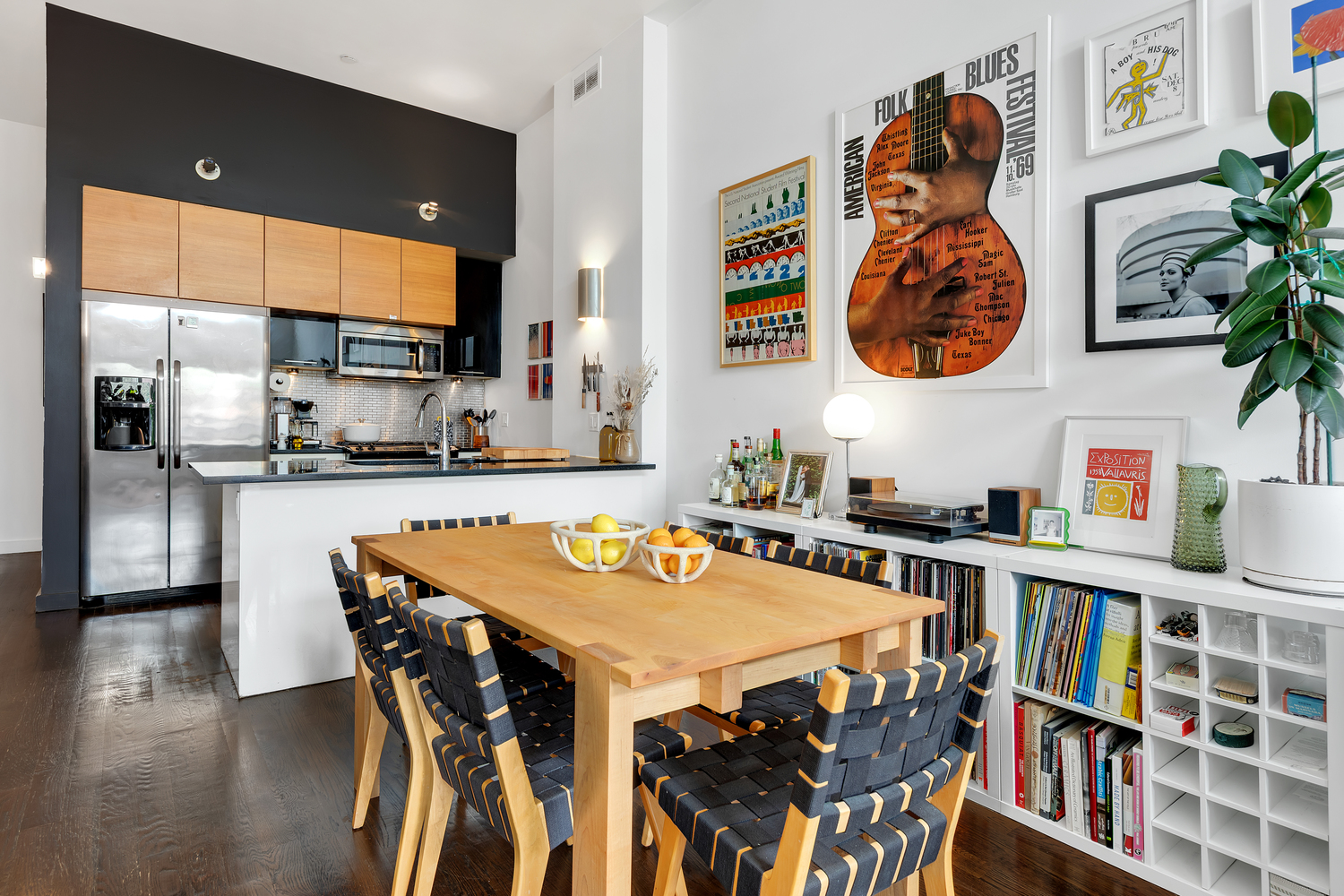27 Quincy Street, Unit 4D Brooklyn, NY 11238 - Photo 3 of 8 a view of a dining room with furniture and a book shelf