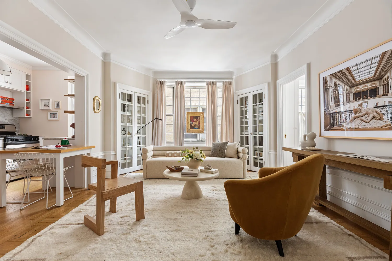 a kitchen with granite countertop white cabinets and stainless steel appliances