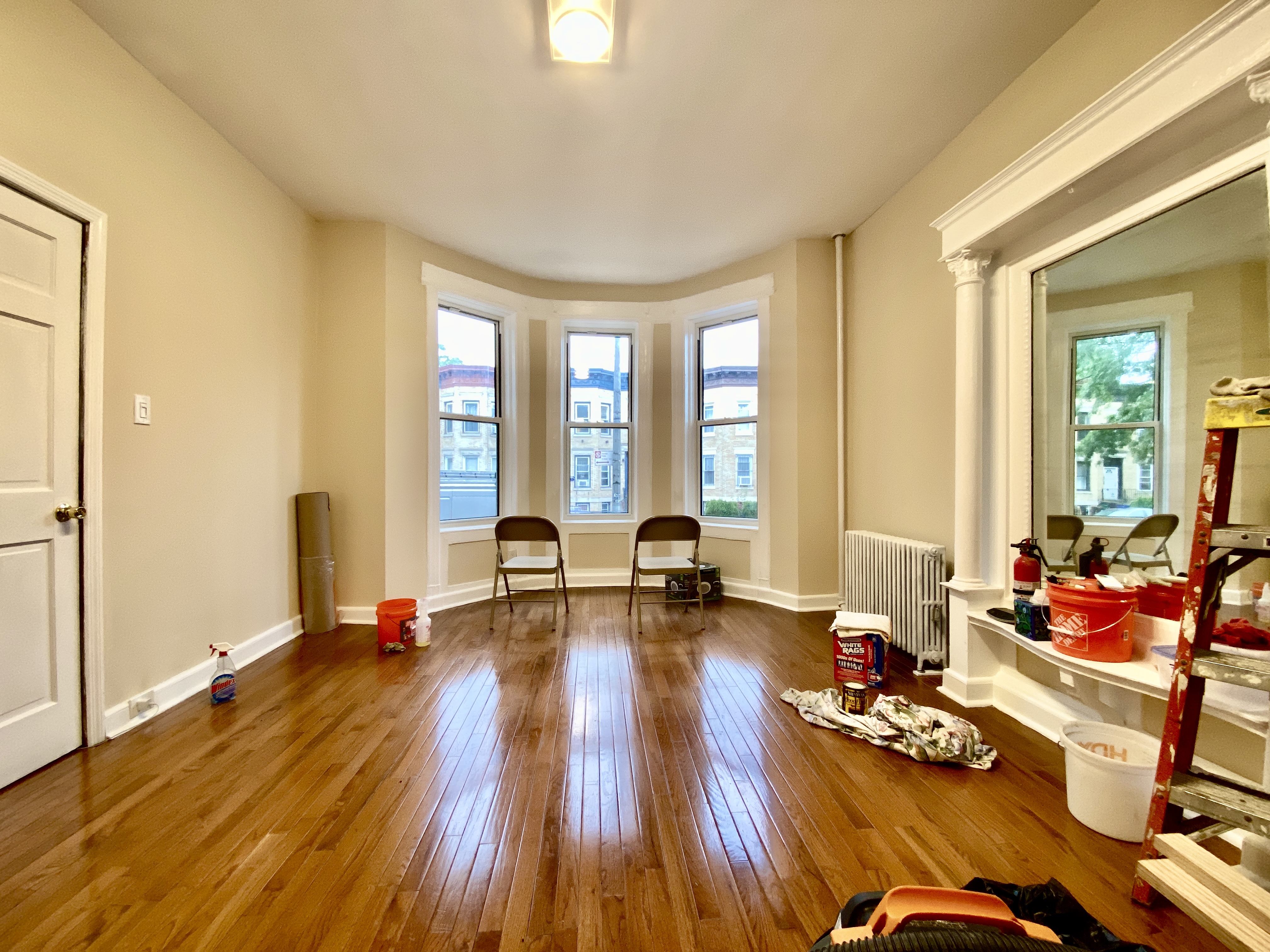 1308 Park Place, Unit 1 Brooklyn, NY 11213 - Photo 3 of 9 a living room with furniture and floor to ceiling windows