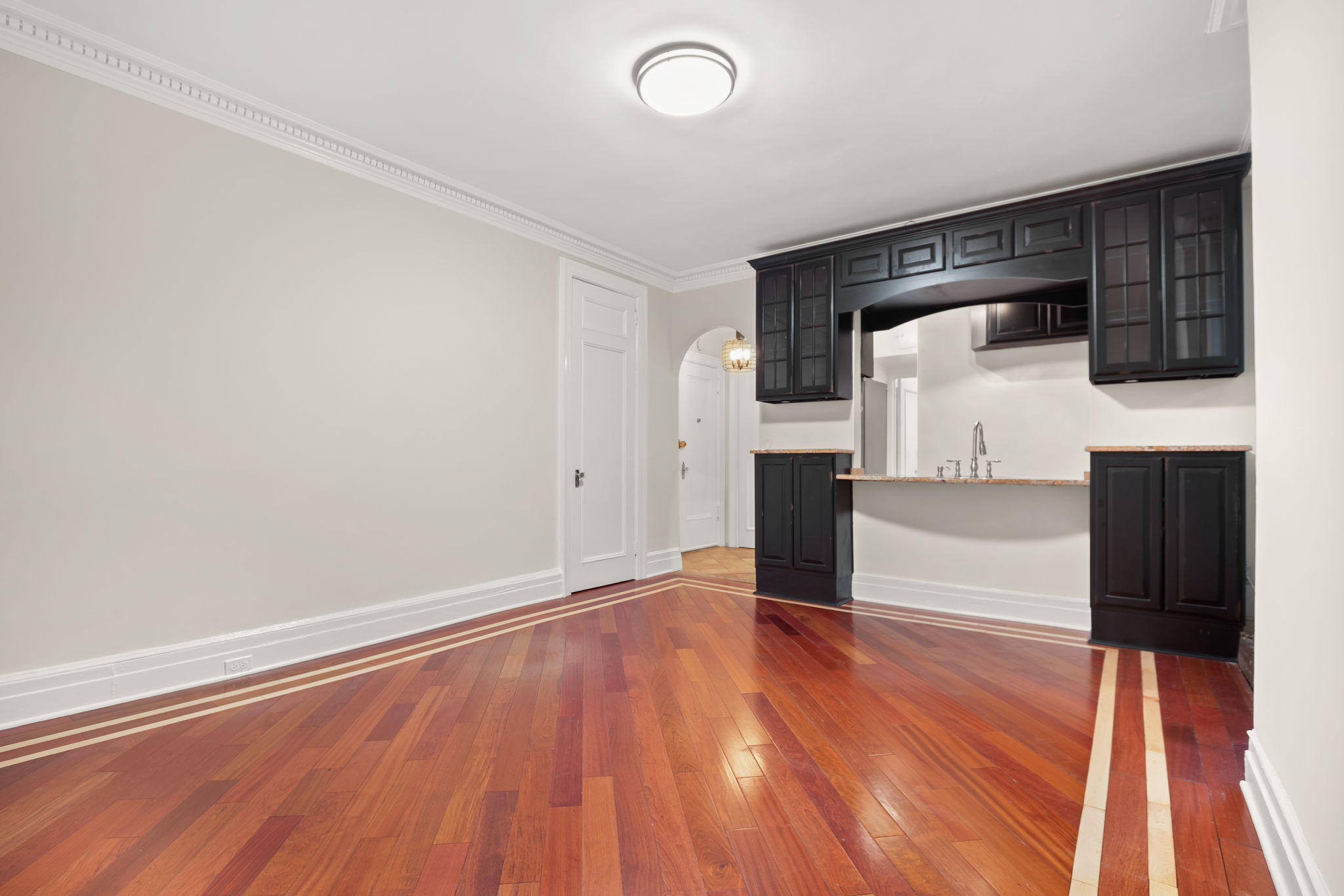 305 West 72nd Street, Unit 7D Manhattan, NY 10023 - Photo 8 of 12 a view of a hardwood floor in a room