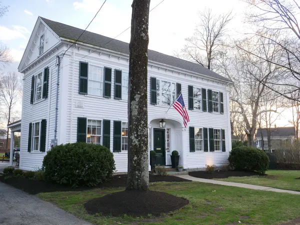 a front view of a house with a yard
