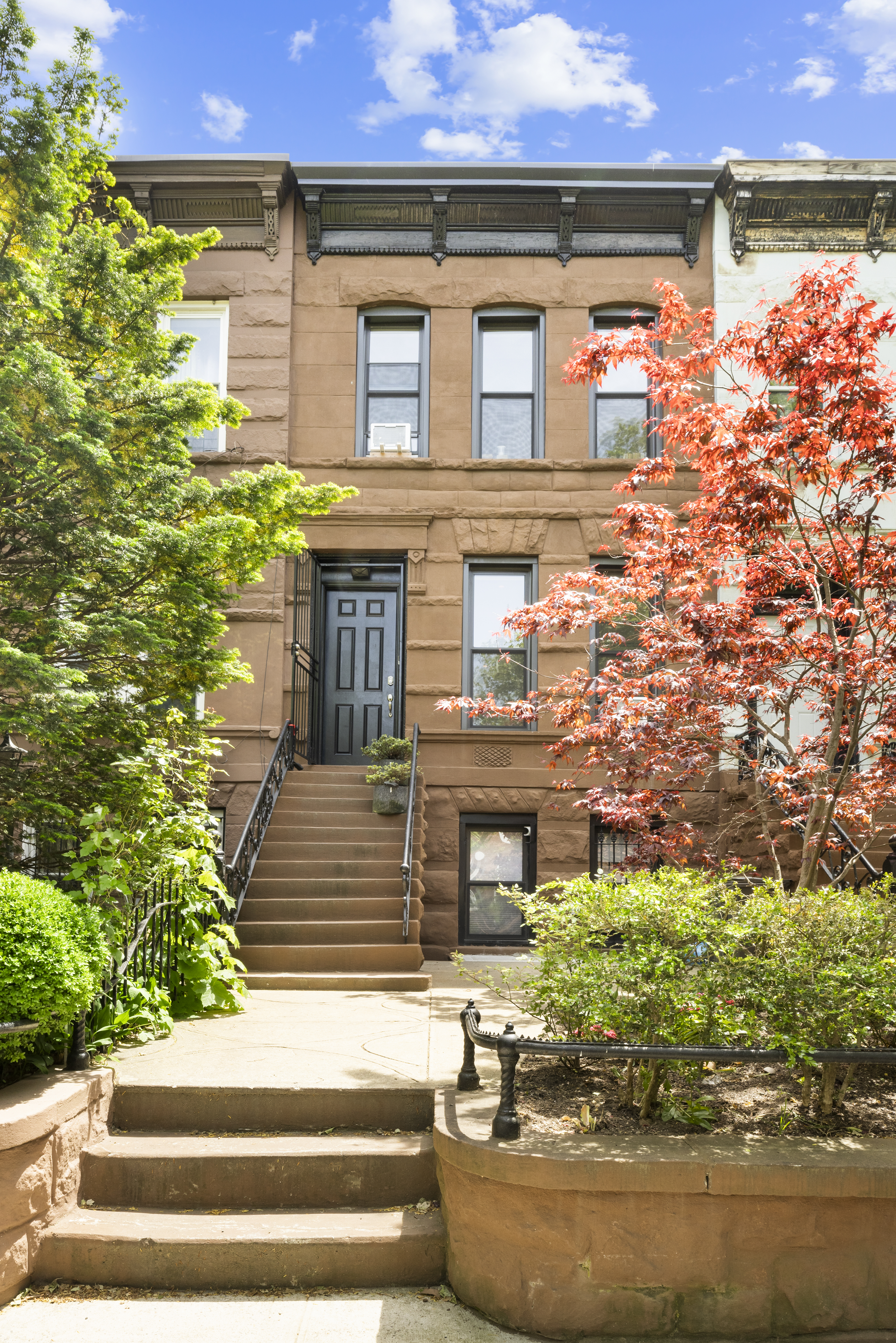 778 Hancock Street, Unit 2 Brooklyn, NY 11233 - Photo 10 of 11 a front view of a house with a yard