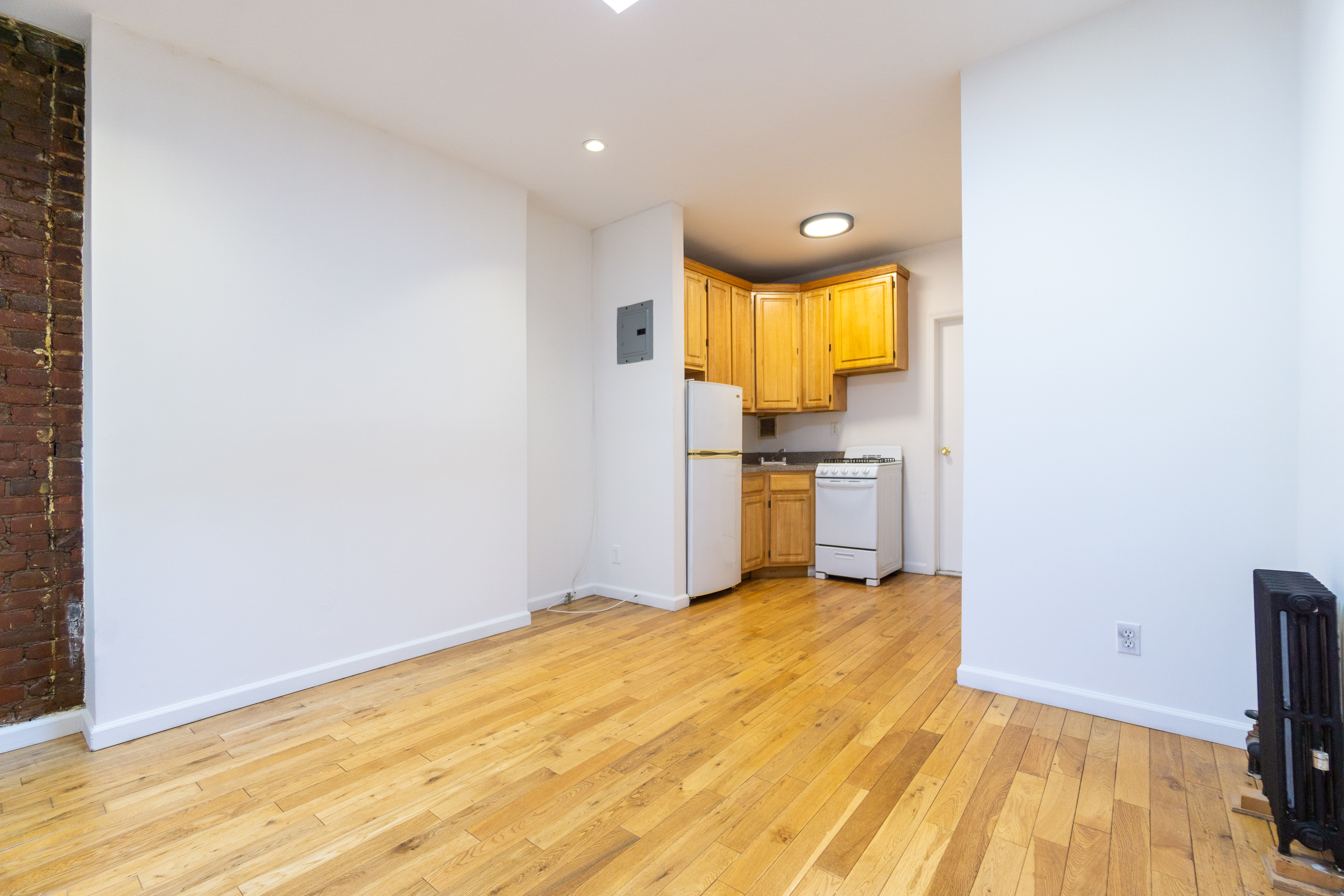 339 East 6th Street, Unit 14 Manhattan, NY 10003 - Photo 5 of 8 a view of empty room with wooden floor