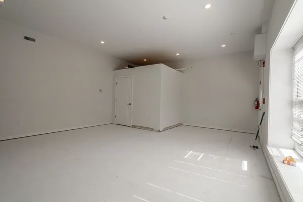 a bathroom with a shower sink and mirror