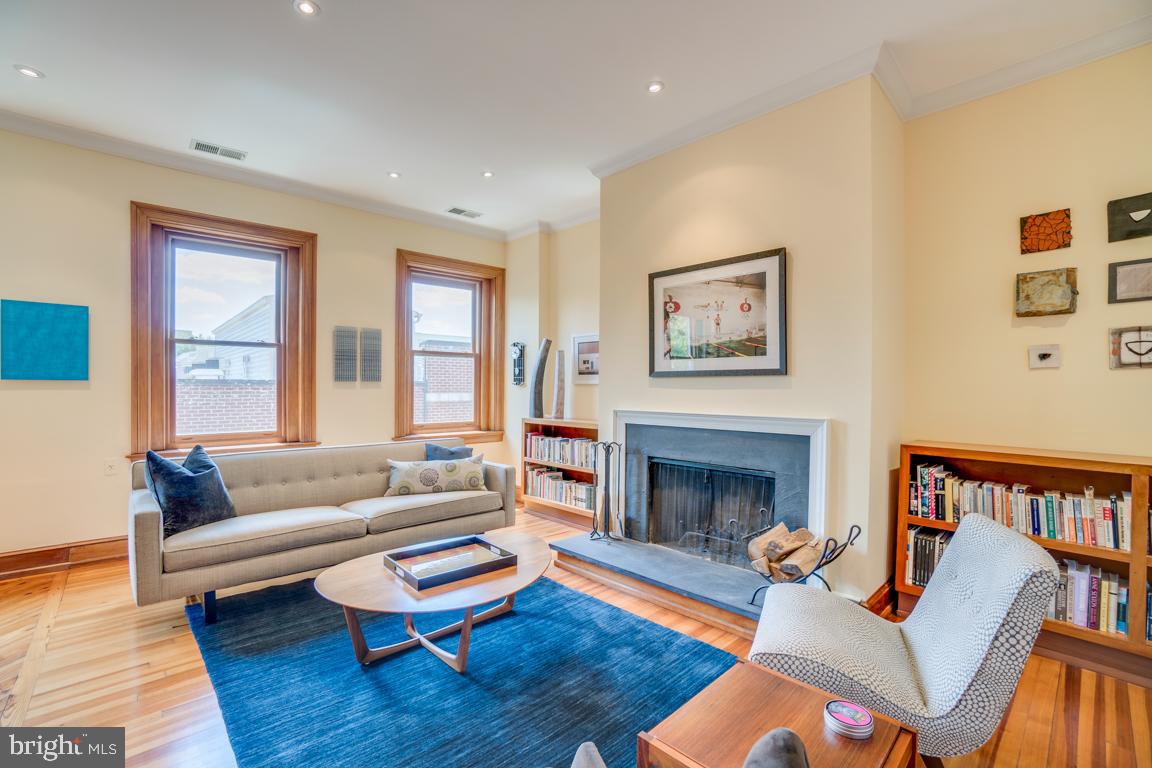 2415 20th Street Northwest, Unit 38 Washington, DC 20009 - Photo 4 of 30 a living room with furniture fireplace and window