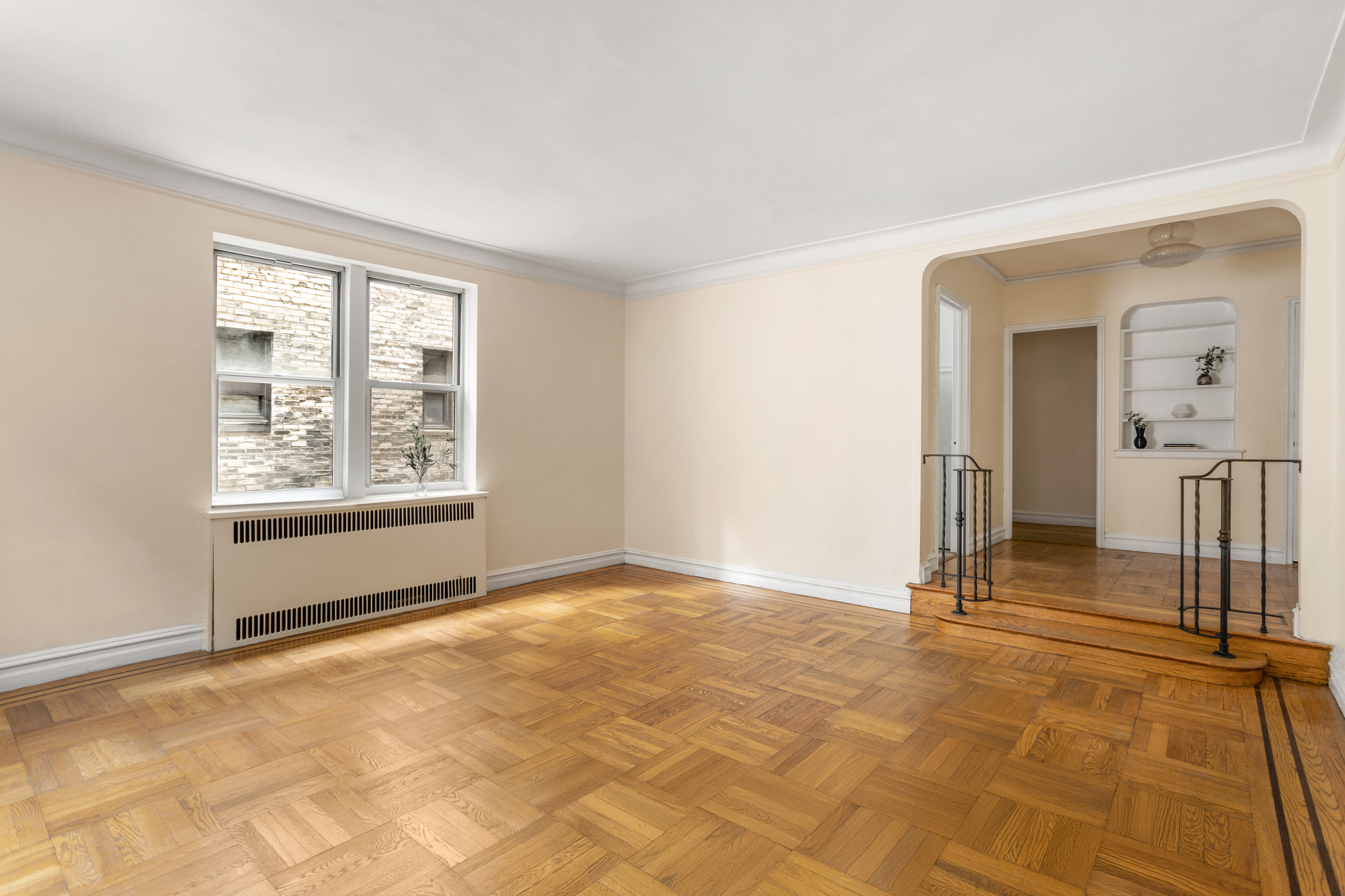 303 East 37th Street, Unit 3B Manhattan, NY 10016 - Photo 4 of 16 a view of a livingroom with a staircase