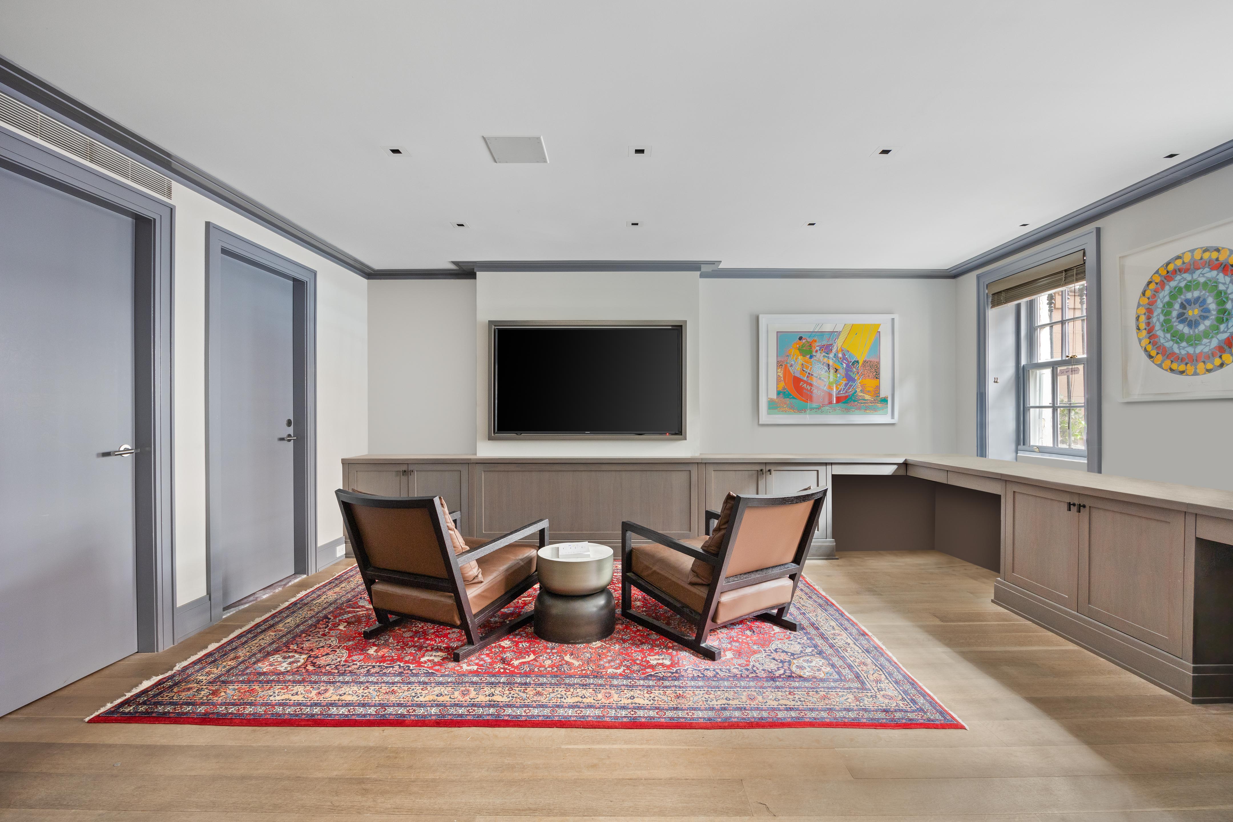 14 West 11th Street, Unit GARDEN Manhattan, NY 10011 - Photo 13 of 18 a living room with furniture and a rug